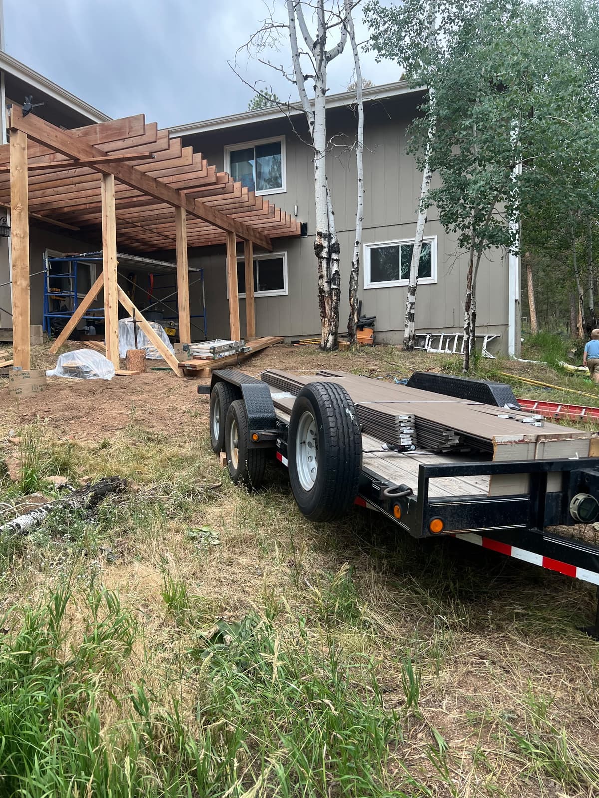 RJG Contracting team at work. Building a composite deck for a happy customer.